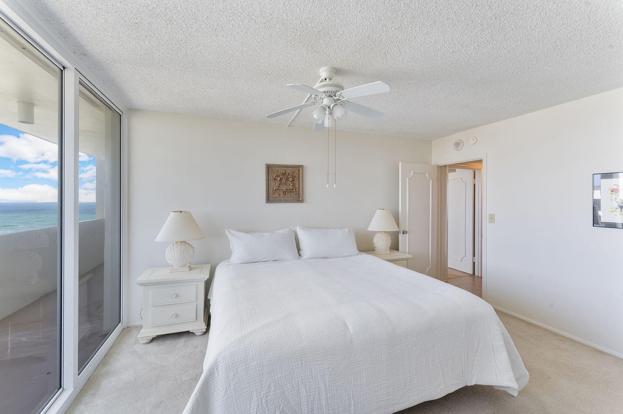 2000 South Ocean Boulevard, Unit 10H Boca Raton, FL 33432 - Photo 25 of 54 a bedroom with a white bed and white walls