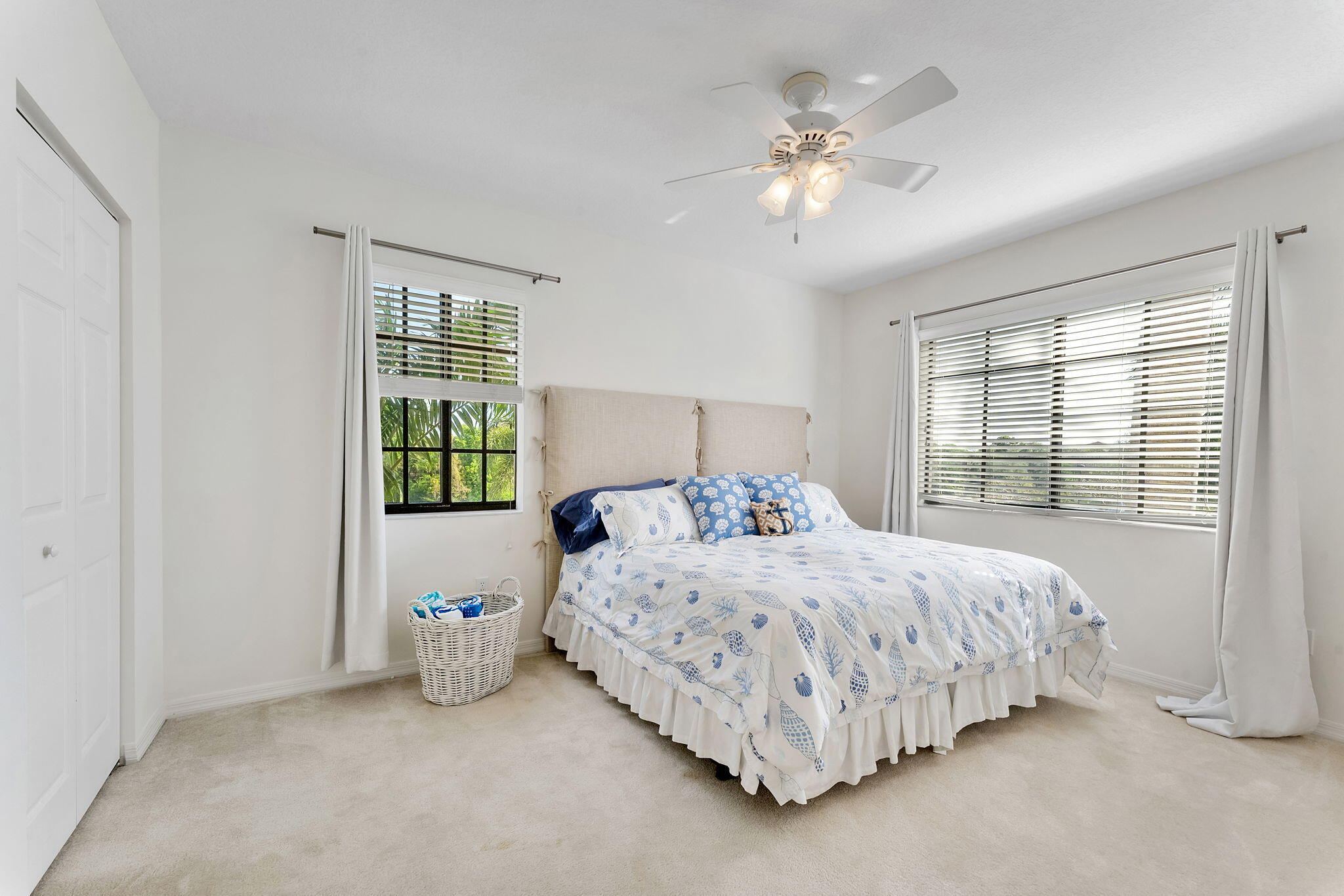 2000 South Ocean Boulevard, Unit 10H Boca Raton, FL 33432 - Photo 27 of 54 a bedroom with a bed and a chandelier