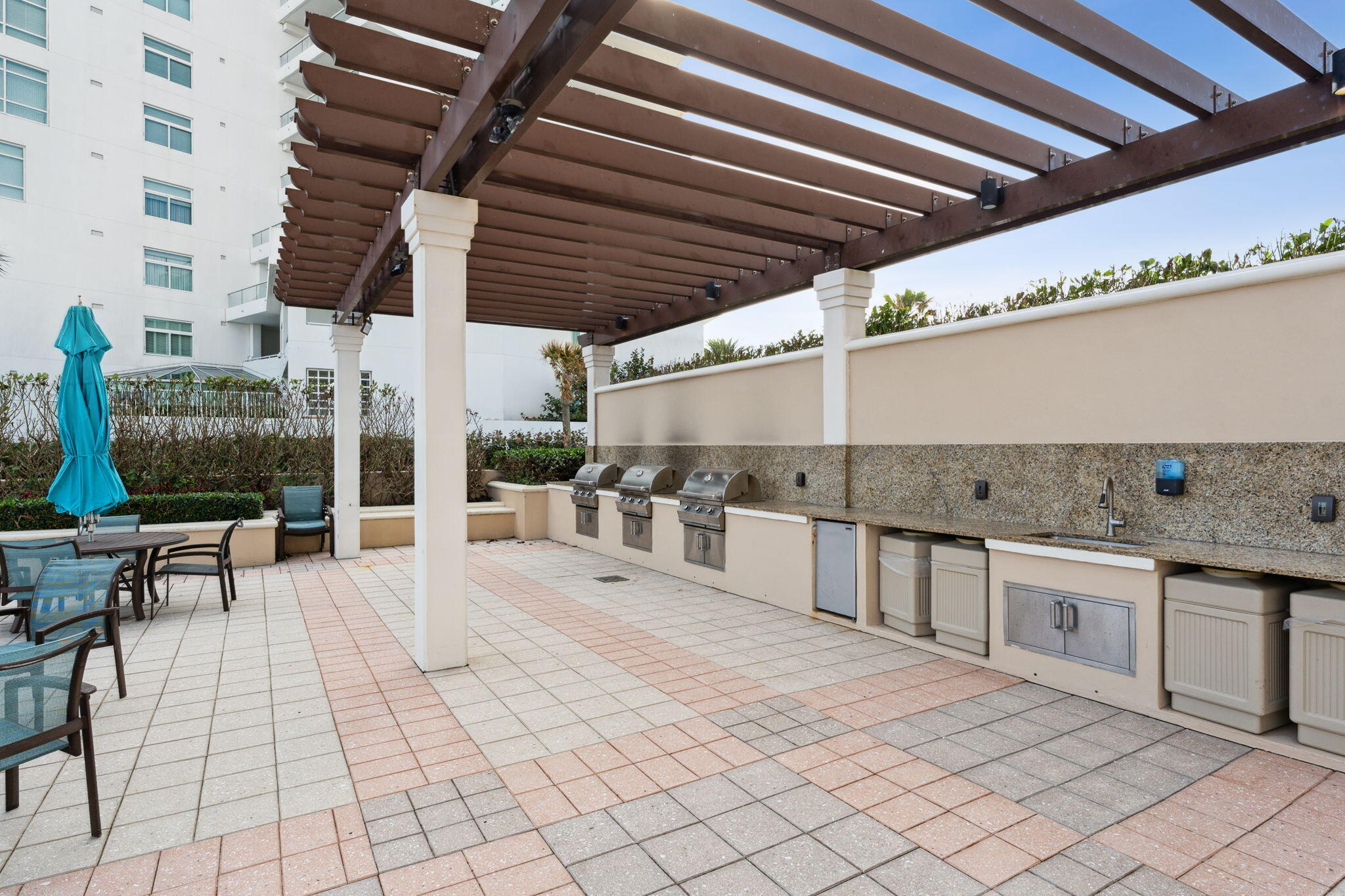 2000 South Ocean Boulevard, Unit 10H Boca Raton, FL 33432 - Photo 49 of 54 a view of a patio with table and chairs