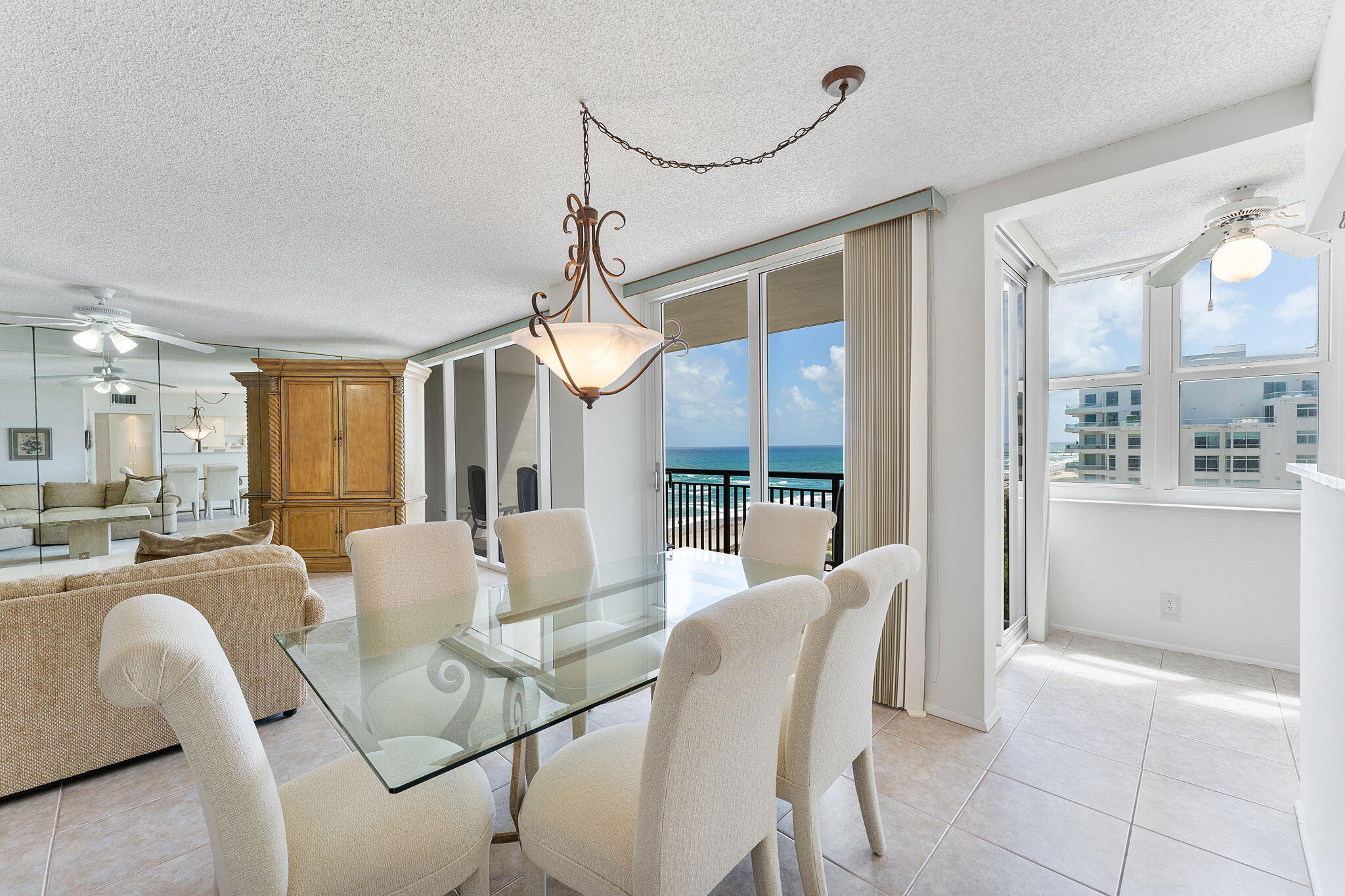 2000 South Ocean Boulevard, Unit 10H Boca Raton, FL 33432 - Photo 5 of 54 a view of a dining room with furniture window and wooden floor