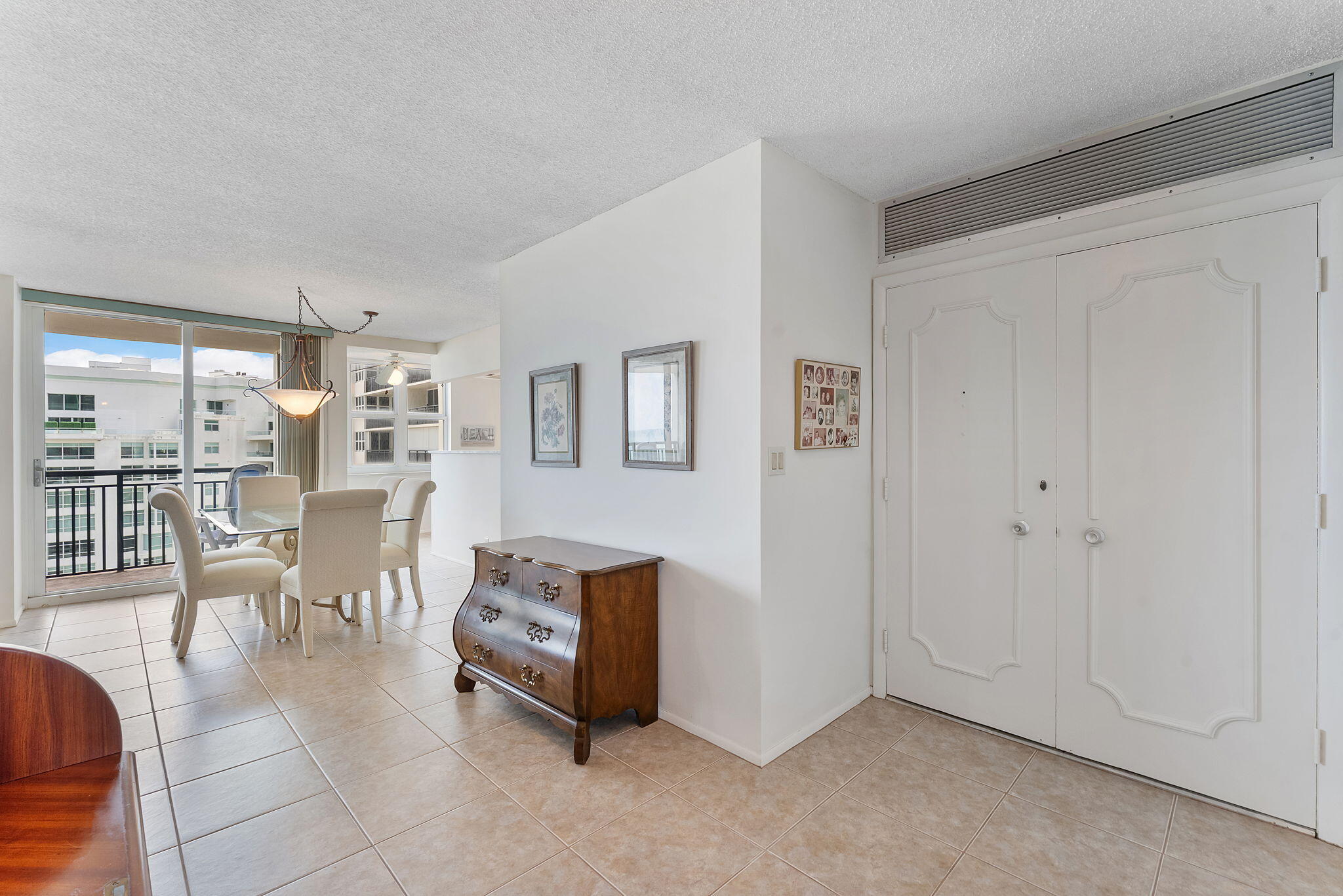 2000 South Ocean Boulevard, Unit 10H Boca Raton, FL 33432 - Photo 9 of 54 a living room with furniture a table and chairs