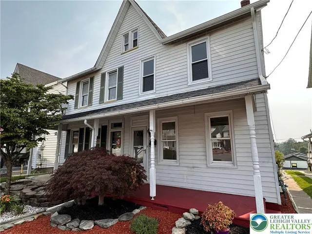 a view of a house with a garden