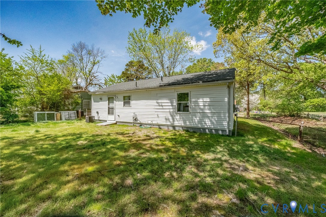 1914 Moger Drive Hampton, VA 23663 - Photo 15 of 15 a backyard of a house with table and chairs
