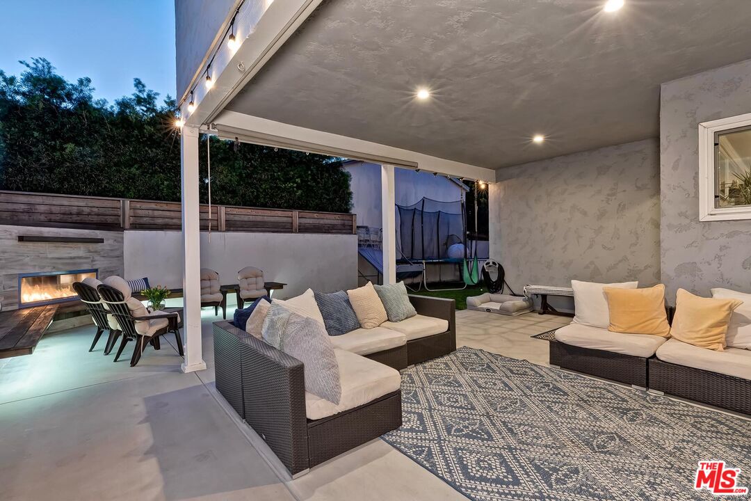 434 West Maple Avenue El Segundo, CA 90245 - Photo 27 of 29 a living room with furniture and a fireplace