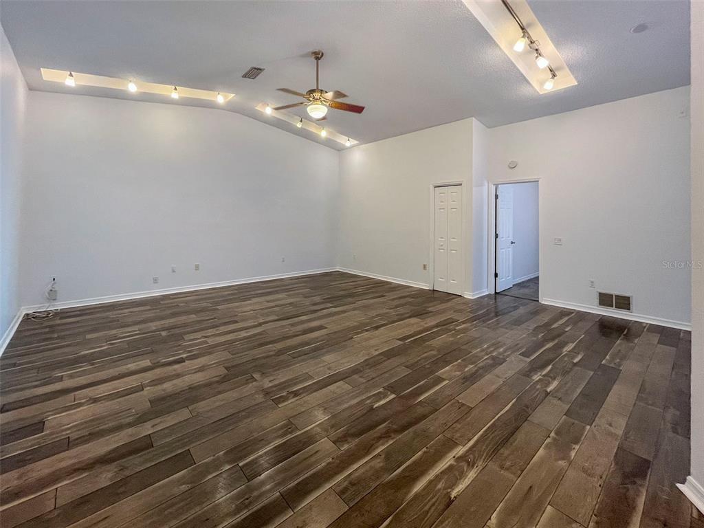 3957 Proctor Road Sarasota, FL 34233 - Photo 3 of 18 a view of empty room with wooden floor