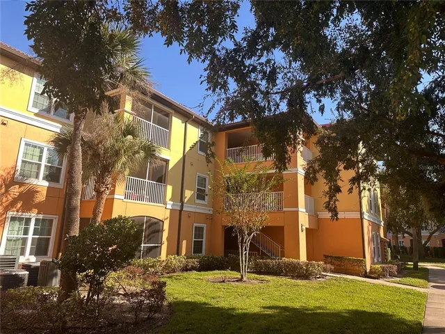 a view of a park with large trees