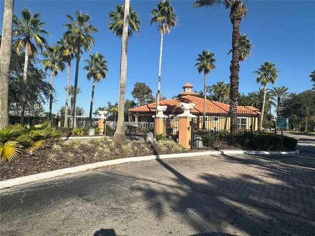 a kitchen with a stove top oven and refrigerator