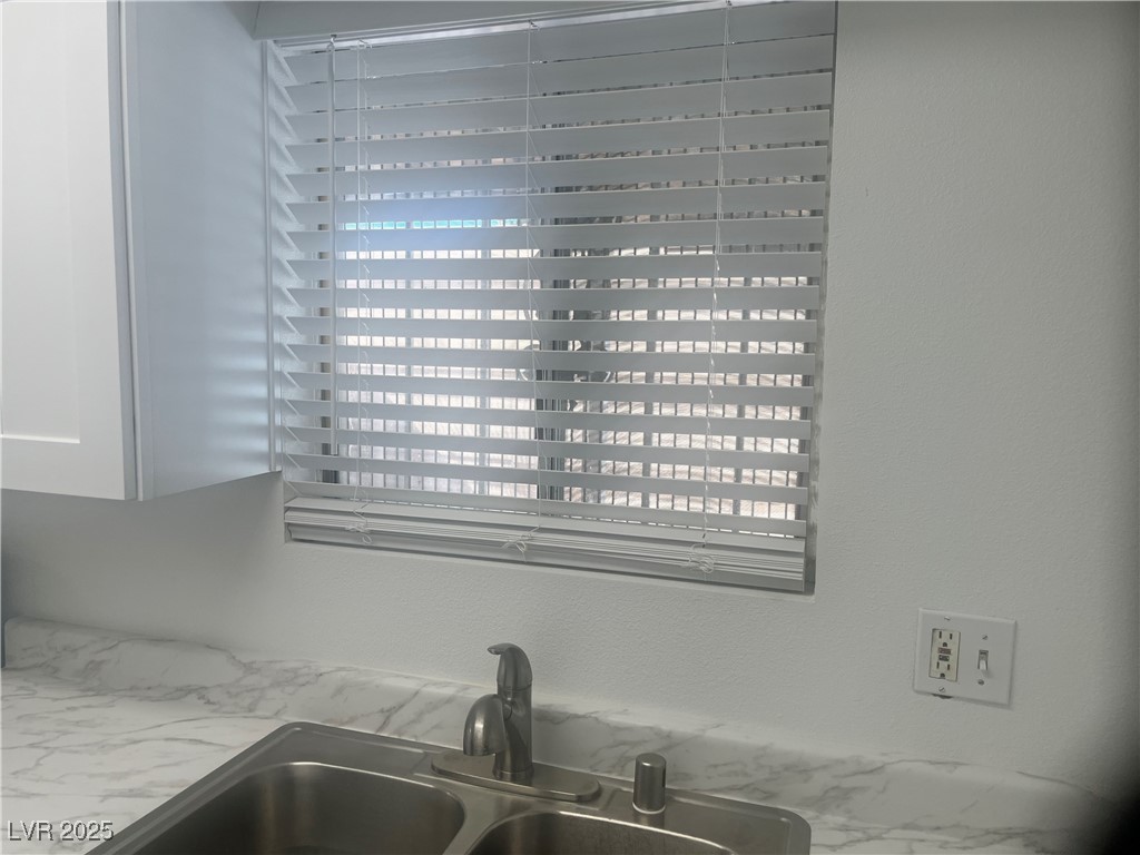 592 Sea Shell Lane Las Vegas, NV 89110 - Photo 8 of 24 Kitchen view of light stone counters