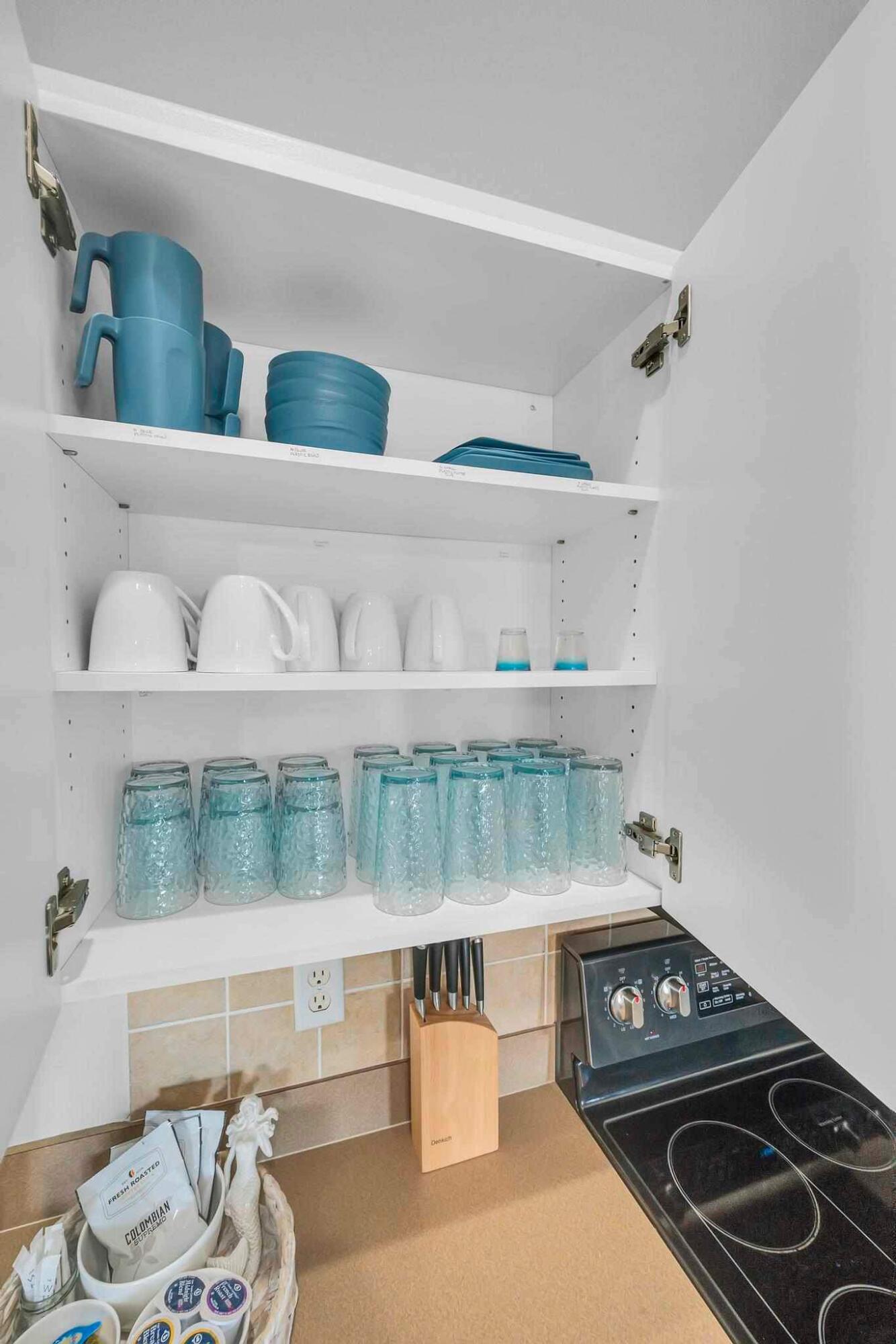 5464 Northwest Milner Drive Port St. Lucie, FL 34983 - Photo 16 of 49 a kitchen with a stove top oven and cabinets