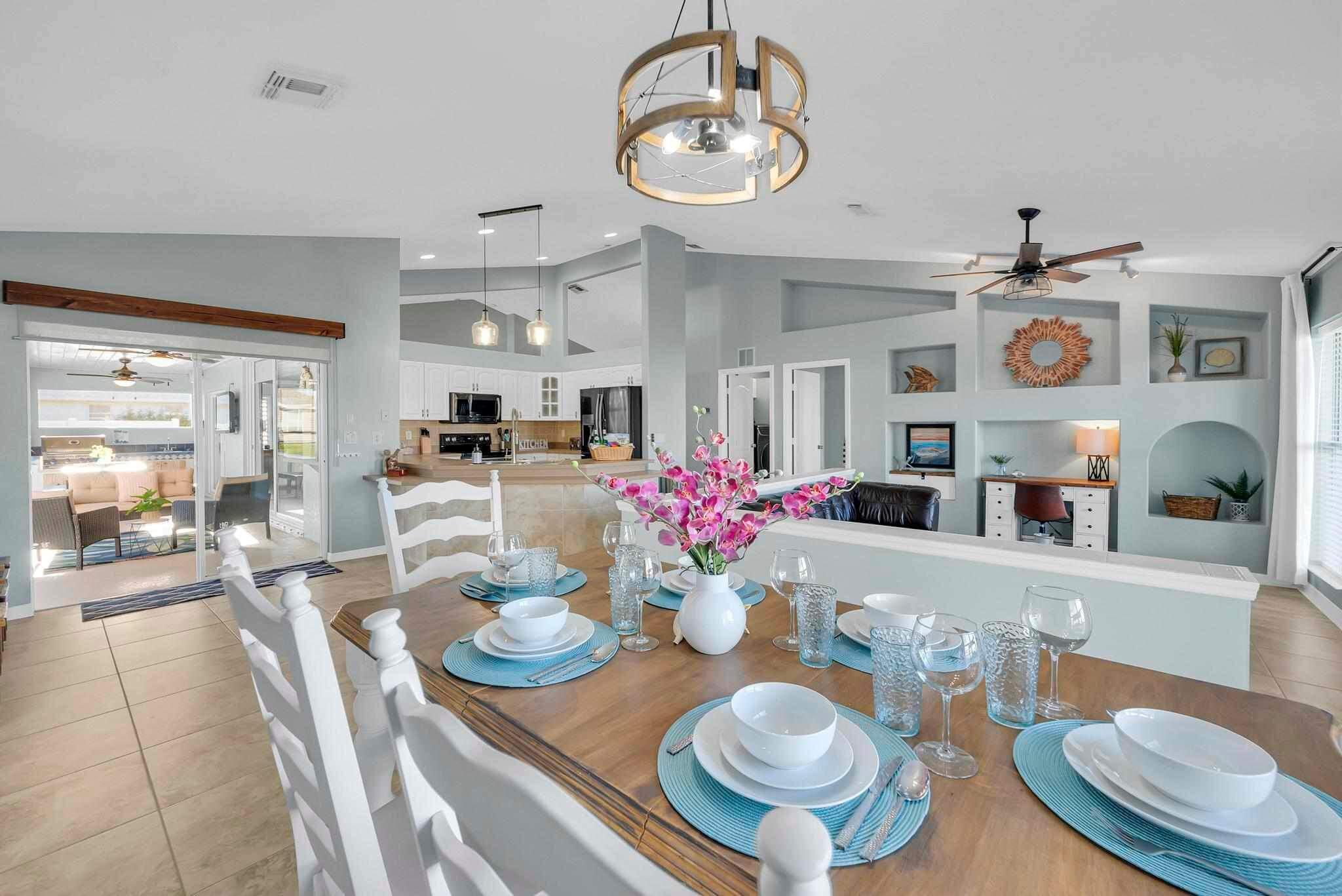 5464 Northwest Milner Drive Port St. Lucie, FL 34983 - Photo 19 of 49 a view of a dining room with furniture