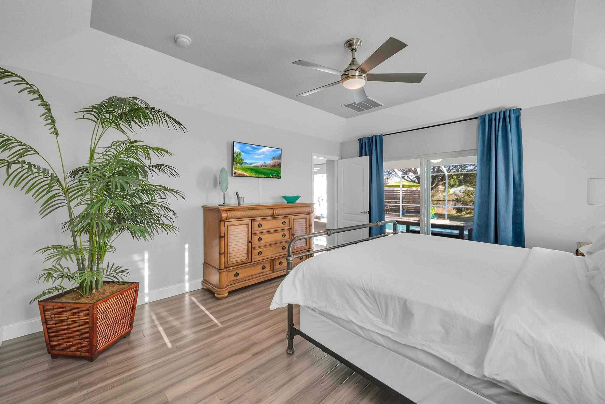 5464 Northwest Milner Drive Port St. Lucie, FL 34983 - Photo 23 of 49 a bedroom with a large bed and a window