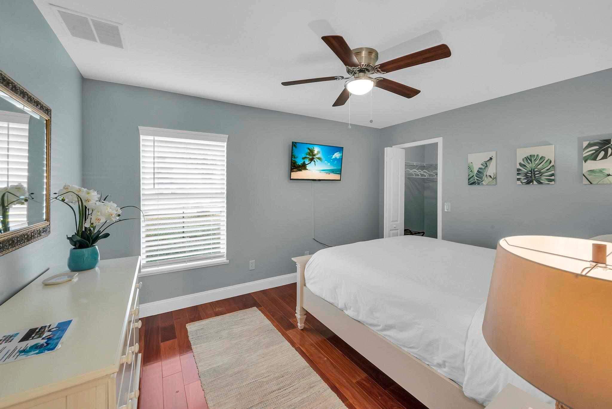 5464 Northwest Milner Drive Port St. Lucie, FL 34983 - Photo 29 of 49 a bedroom with a bed and a large window