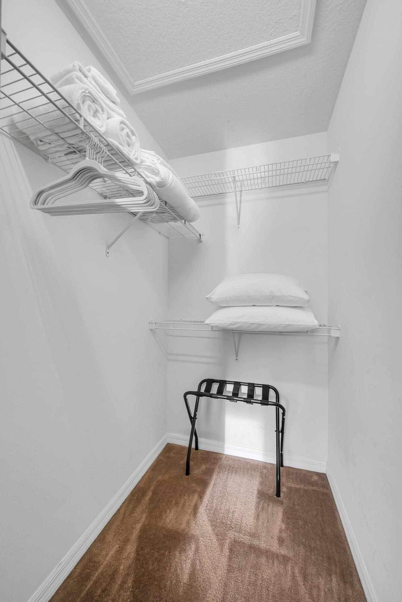 5464 Northwest Milner Drive Port St. Lucie, FL 34983 - Photo 32 of 49 a view of a room with racks on the wall