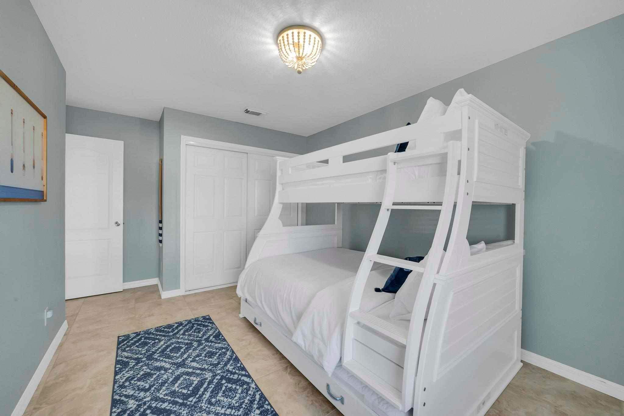 5464 Northwest Milner Drive Port St. Lucie, FL 34983 - Photo 34 of 49 a bedroom with a white bed and a window