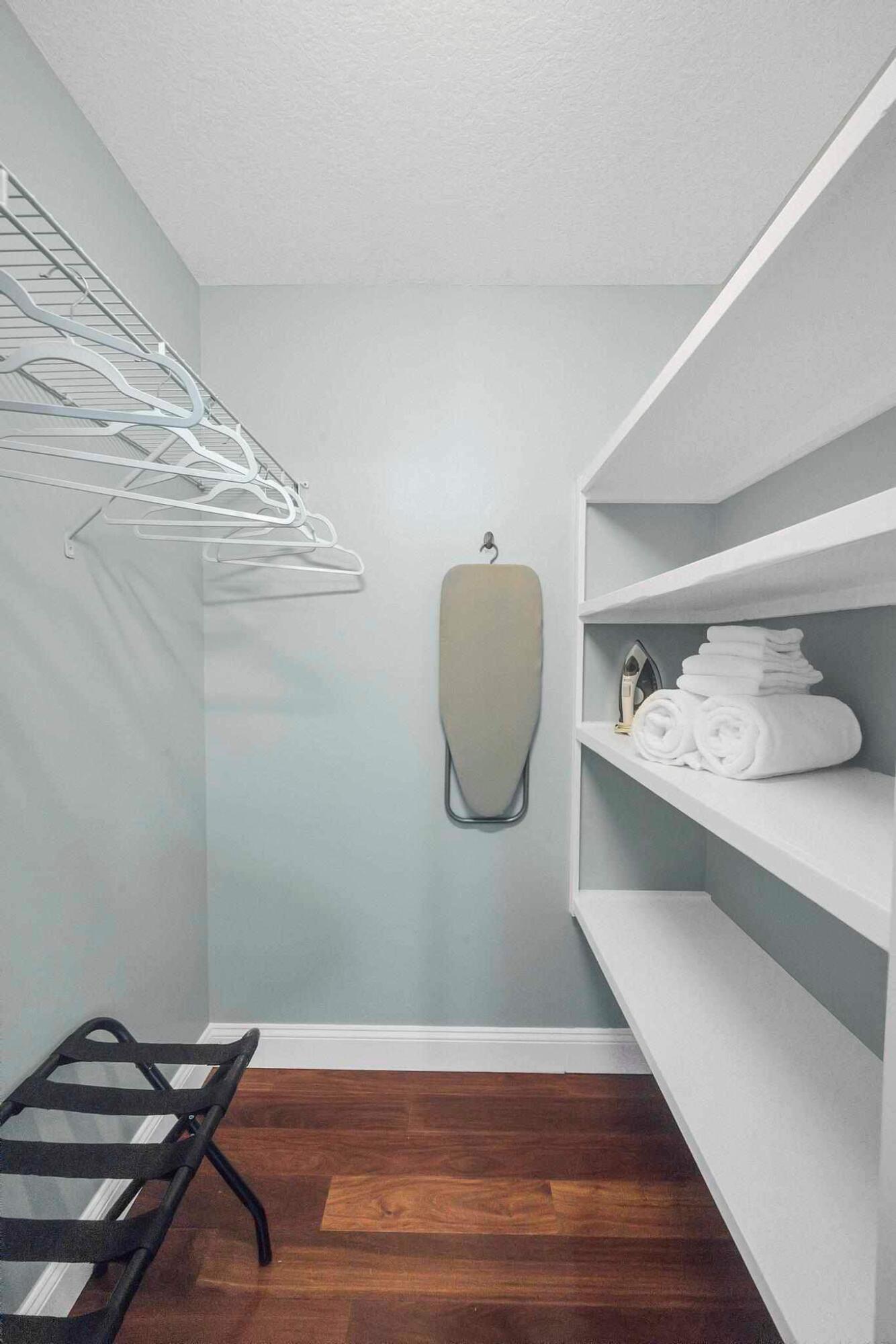 5464 Northwest Milner Drive Port St. Lucie, FL 34983 - Photo 35 of 49 a view of a room with wooden floor and cabinets