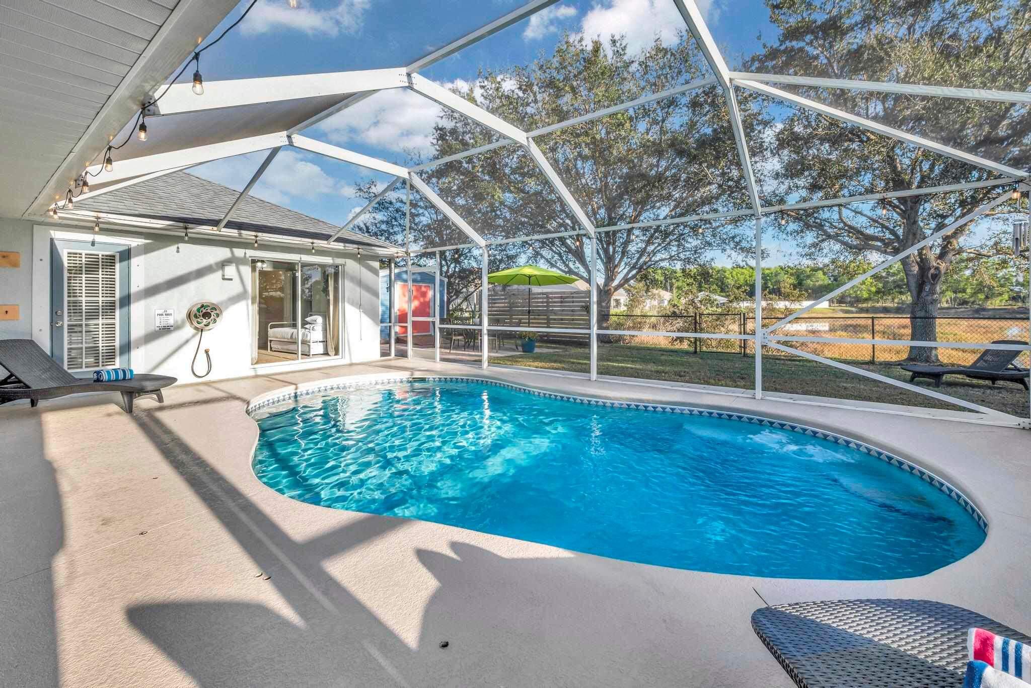 5464 Northwest Milner Drive Port St. Lucie, FL 34983 - Photo 41 of 49 a view of a swimming pool with a patio