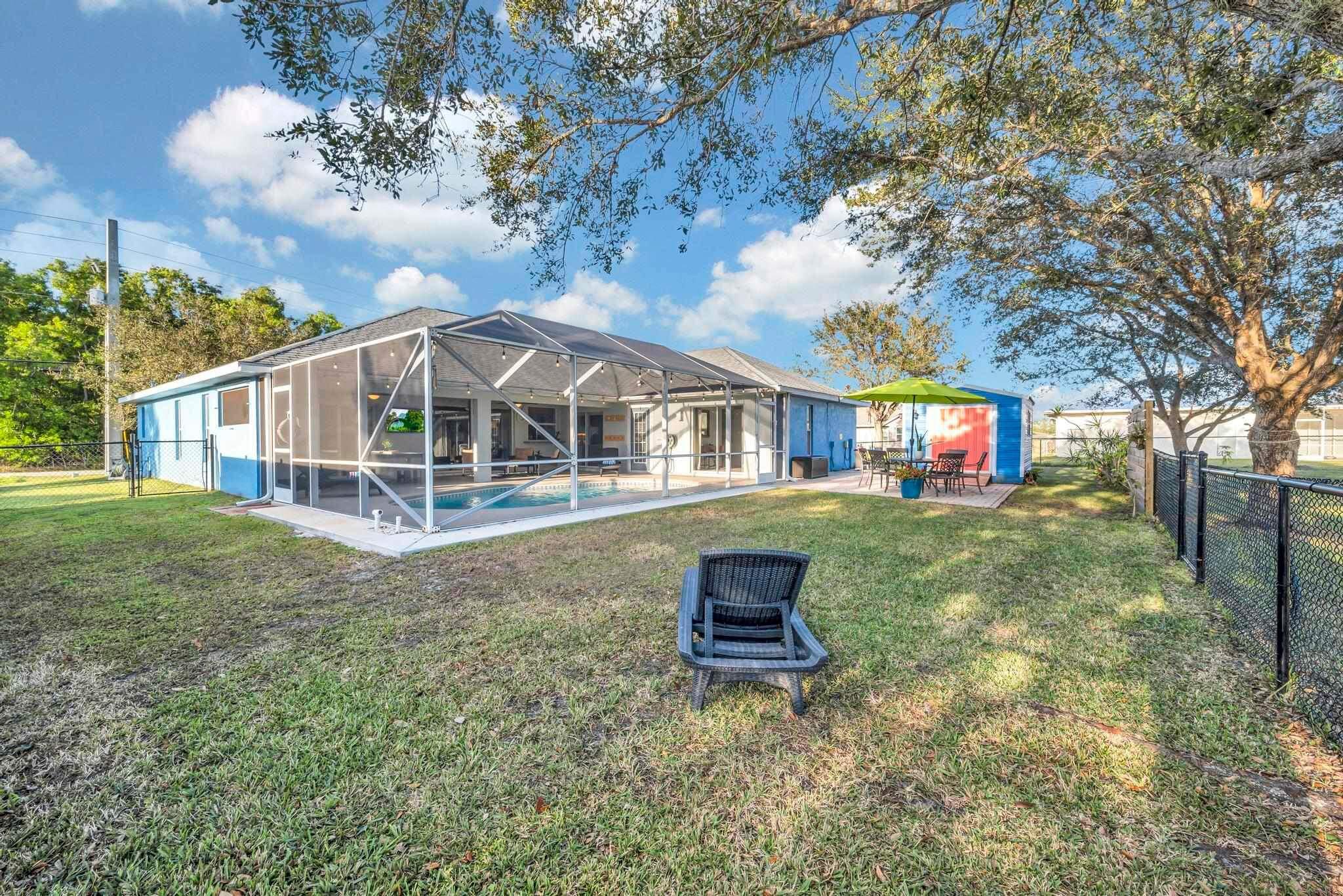 5464 Northwest Milner Drive Port St. Lucie, FL 34983 - Photo 47 of 49 a house view with a garden space