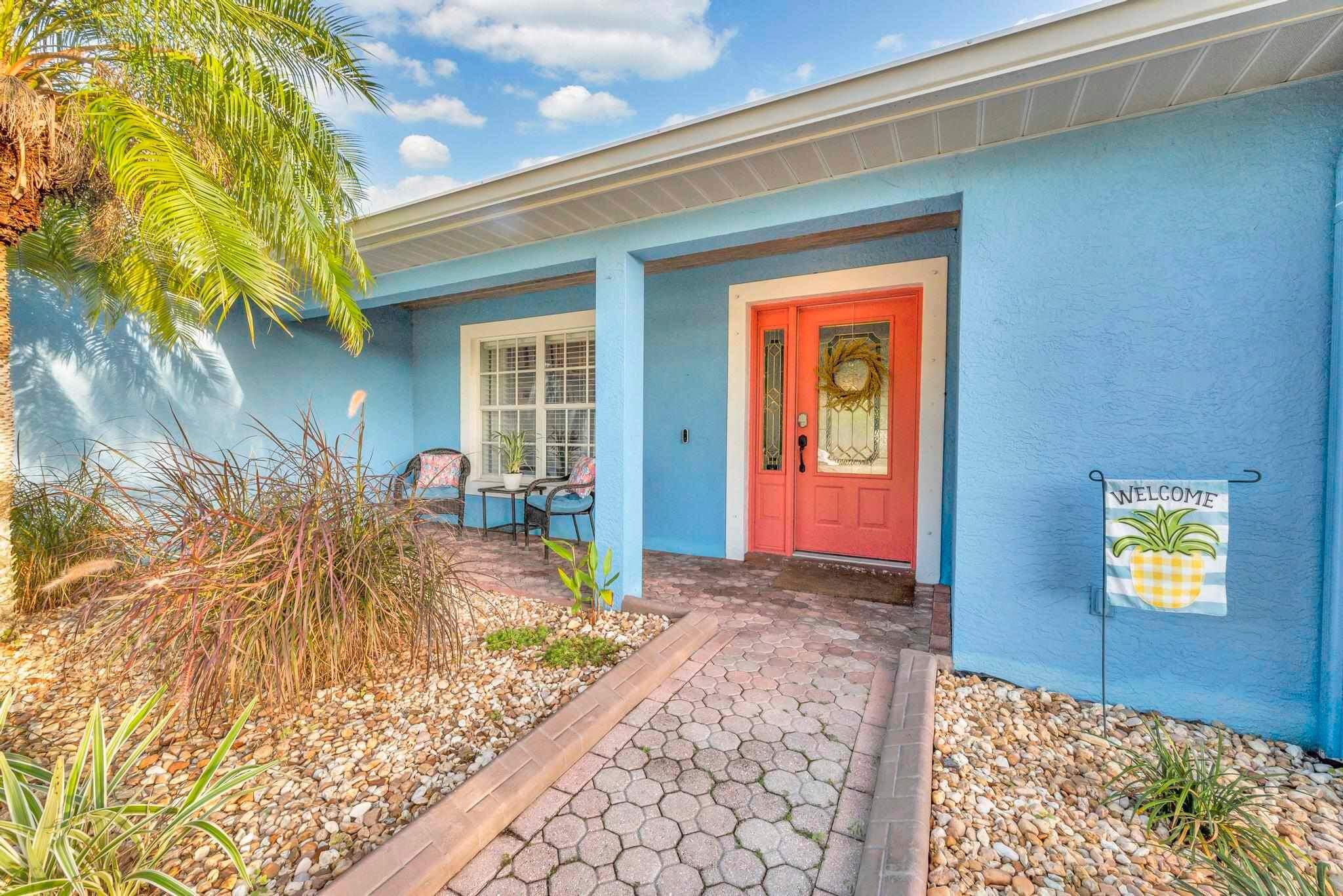 5464 Northwest Milner Drive Port St. Lucie, FL 34983 - Photo 5 of 49 a front view of a house