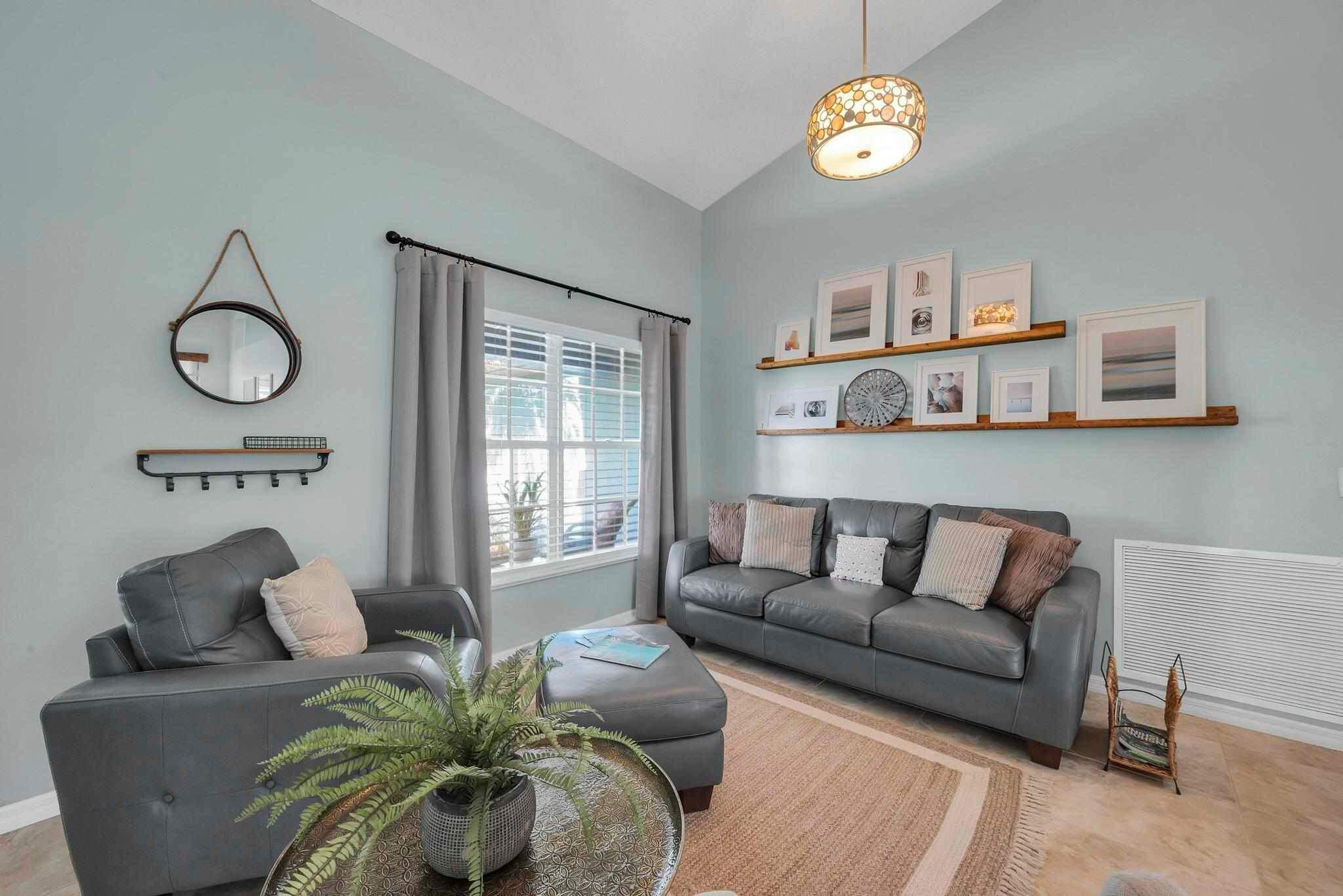 5464 Northwest Milner Drive Port St. Lucie, FL 34983 - Photo 7 of 49 a living room with furniture and a window