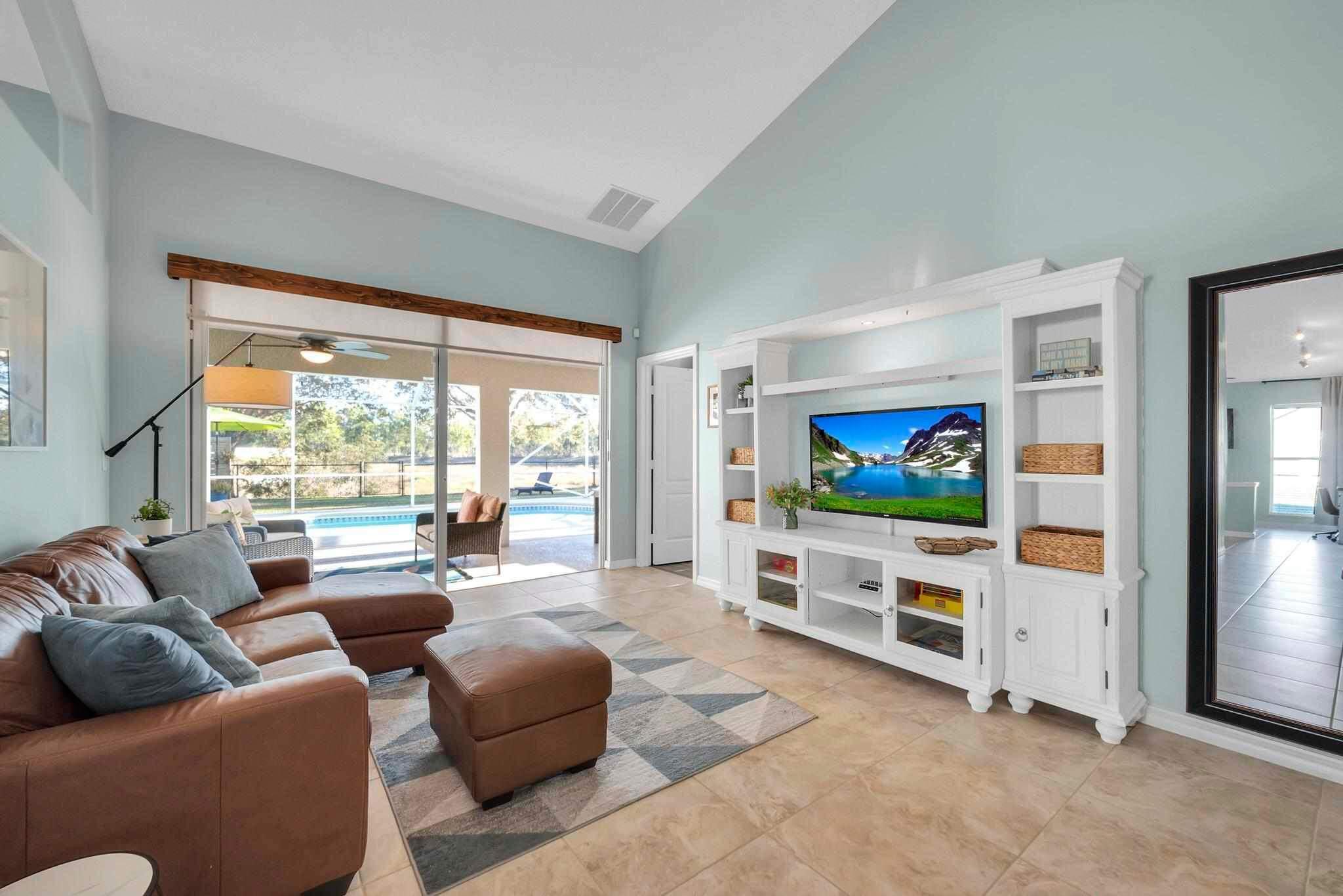 5464 Northwest Milner Drive Port St. Lucie, FL 34983 - Photo 8 of 49 a living room with furniture and a flat screen tv