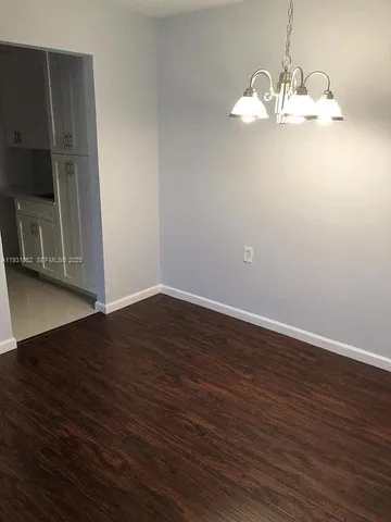a view of a livingroom with wooden floor