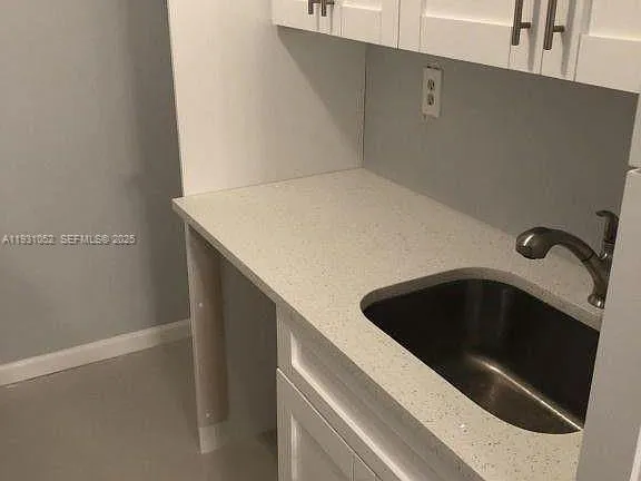 a kitchen with a sink and a washer