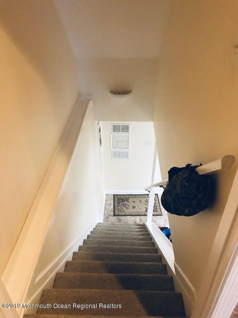 176 Stony Road Edison, NJ 08817 - Photo 17 of 29 a bedroom with a bed and a large window