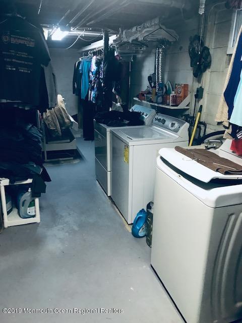 176 Stony Road Edison, NJ 08817 - Photo 25 of 29 a room with water heater and a wooden floors