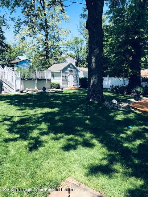 176 Stony Road Edison, NJ 08817 - Photo 27 of 29 a front view of house with yard and green space