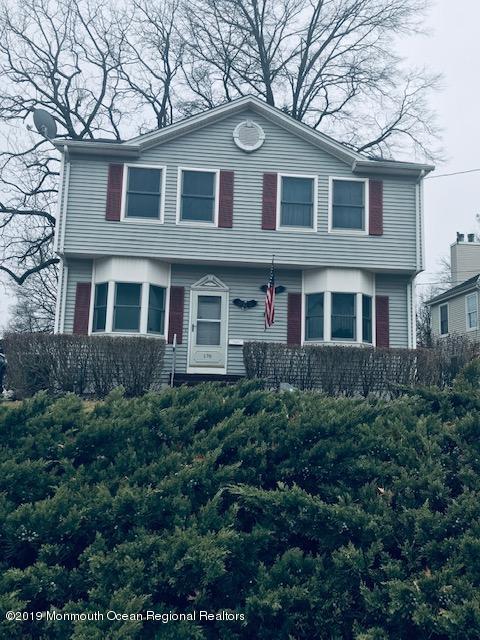 176 Stony Road Edison, NJ 08817 - Photo 3 of 29 a front view of a house with yard and trees