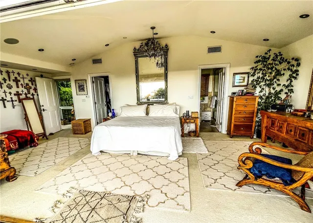 a bed room with a bed and a chair