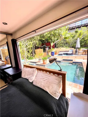 a living room with large window and a couch