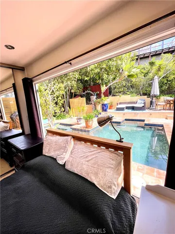 a living room with large window and a couch