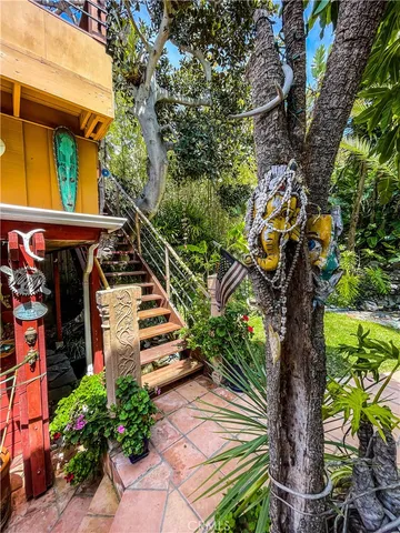 a view of a backyard with a table and chairs