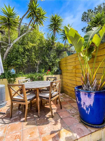 a view of a fountain in back yard of the house