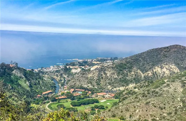 a view of a house with a ocean view
