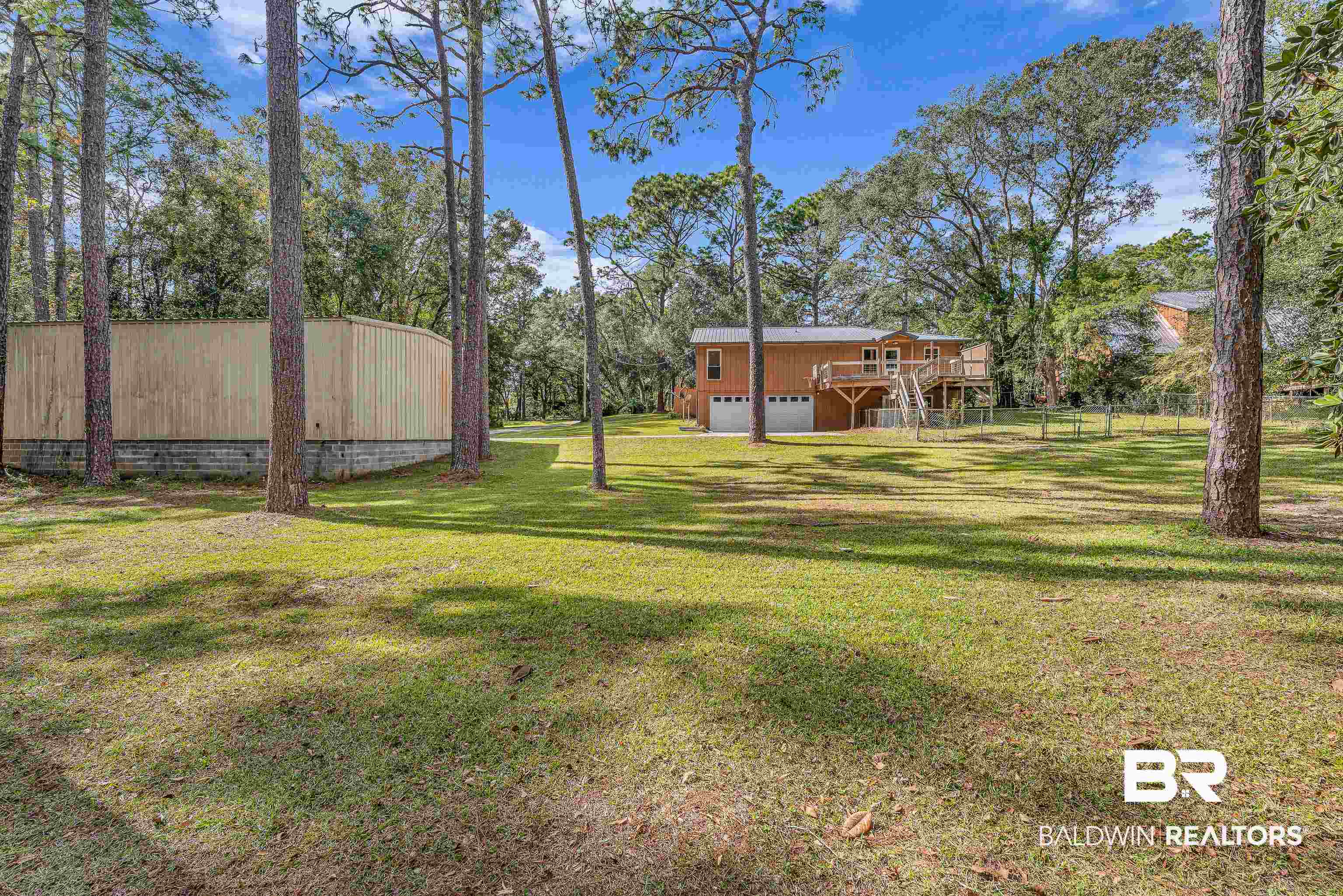 22970 River Road South Daphne, AL 36526 - Photo 11 of 48 View of yard with stairway and a deck