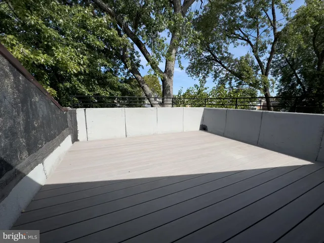 a terrace view with sitting space and wooden floor