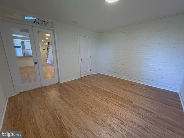 a bathroom with a toilet sink vanity and shower