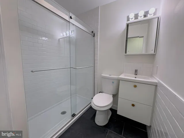 a view of a bathroom with a washer and dryer