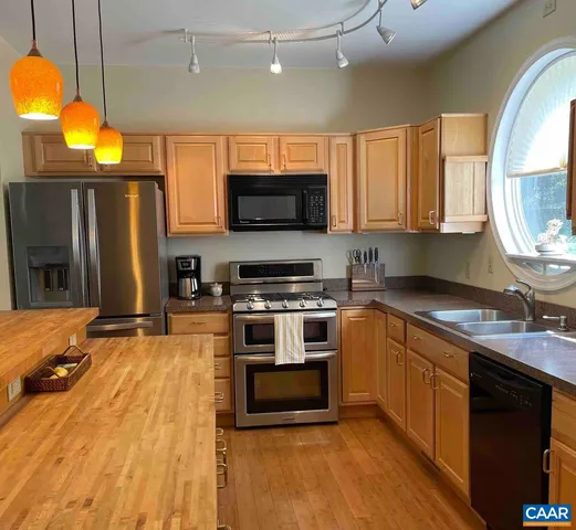 a view of balcony with deck and wooden floor
