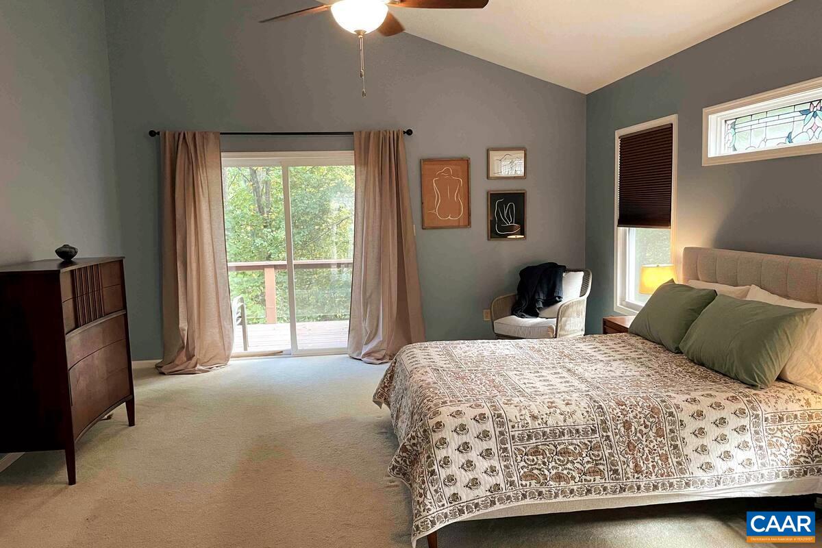 62 Summit Court Roseland, VA 22967 - Photo 16 of 75 a bedroom with a bed flat screen tv and window