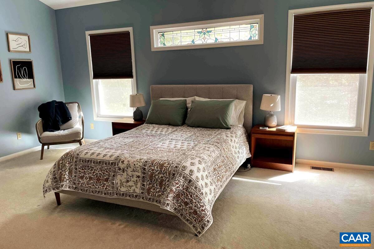 62 Summit Court Roseland, VA 22967 - Photo 17 of 75 a bedroom with a bed and a couch