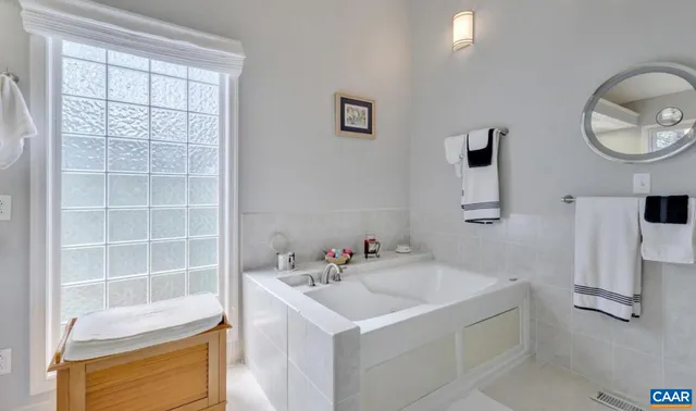 a bedroom with a bed and lamp