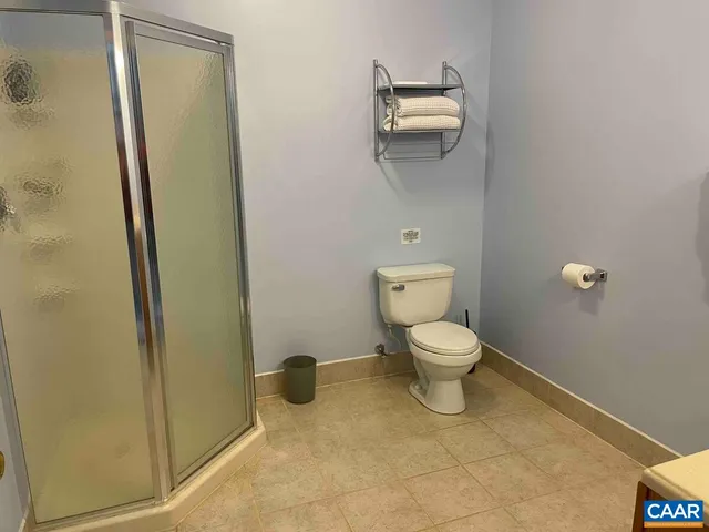 a view of a house with backyard porch and sitting area