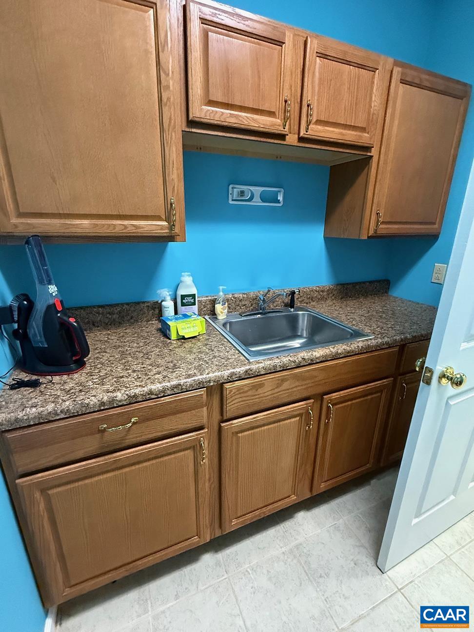 62 Summit Court Roseland, VA 22967 - Photo 34 of 75 a kitchen with granite countertop cabinets sink and microwave