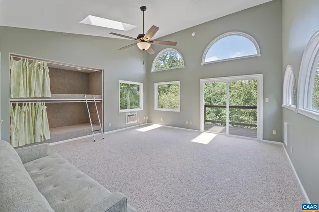 a front view of a house with outdoor seating