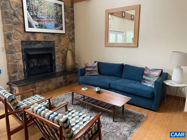 a view of a livingroom with furniture and a dining table