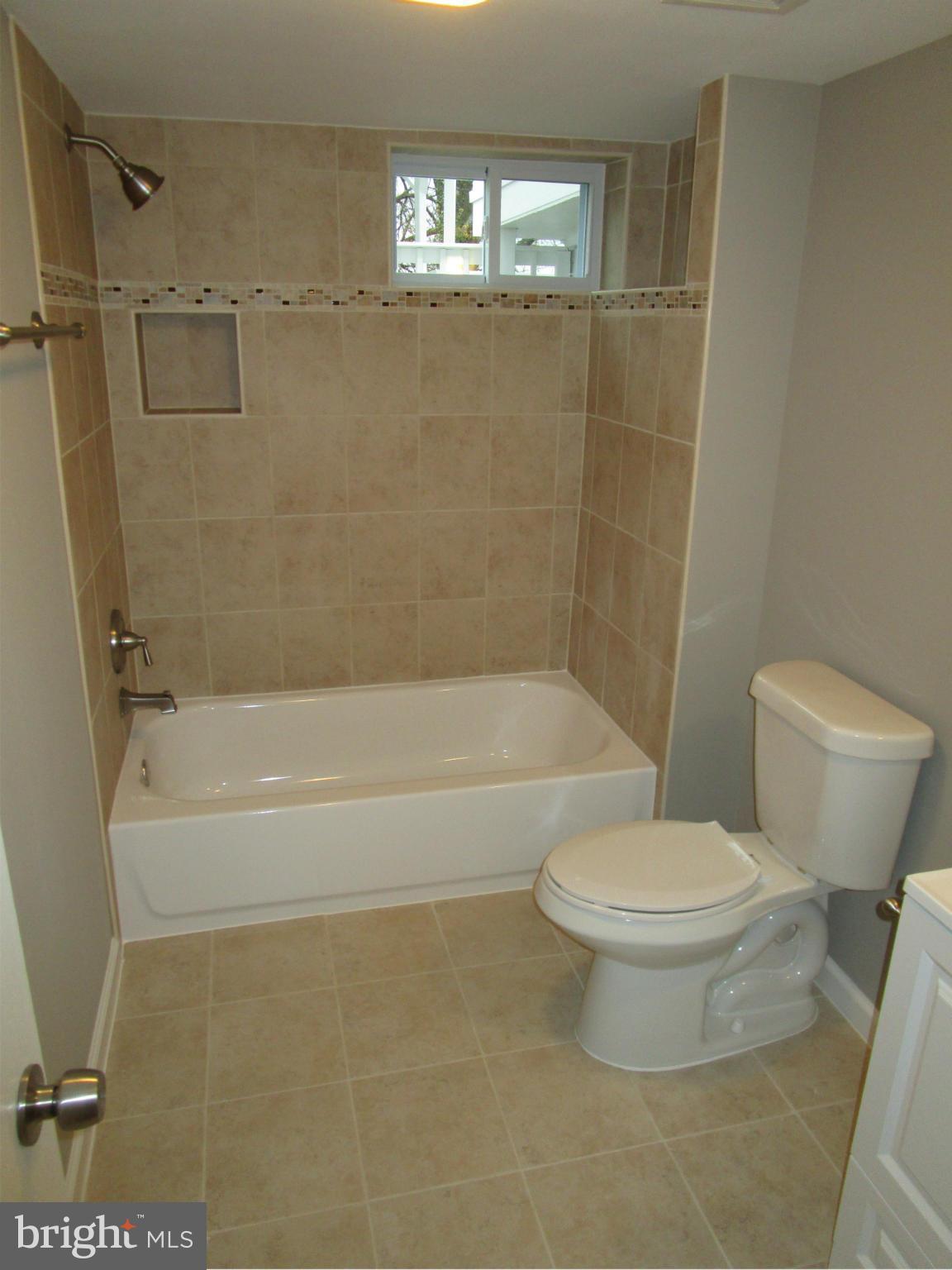 12704 Holdridge Road Silver Spring, MD 20906 - Photo 15 of 22 a bathroom with a toilet and a bathtub