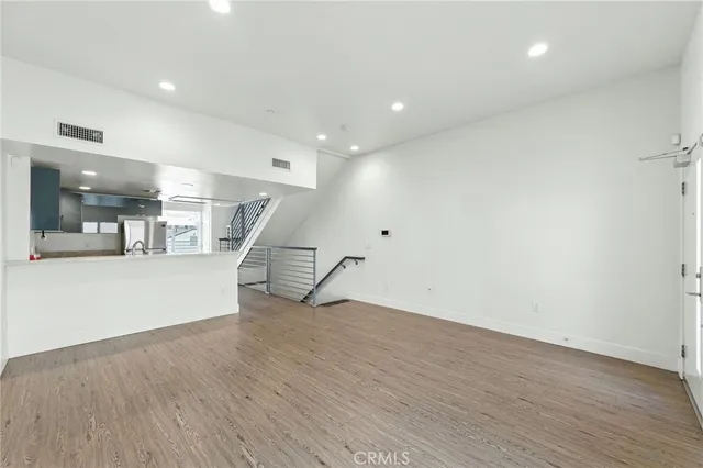 a kitchen with stainless steel appliances granite countertop a sink and stove top oven